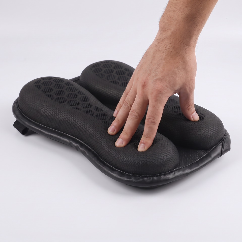 Hand pressing into the honeycomb gel of the passenger pad