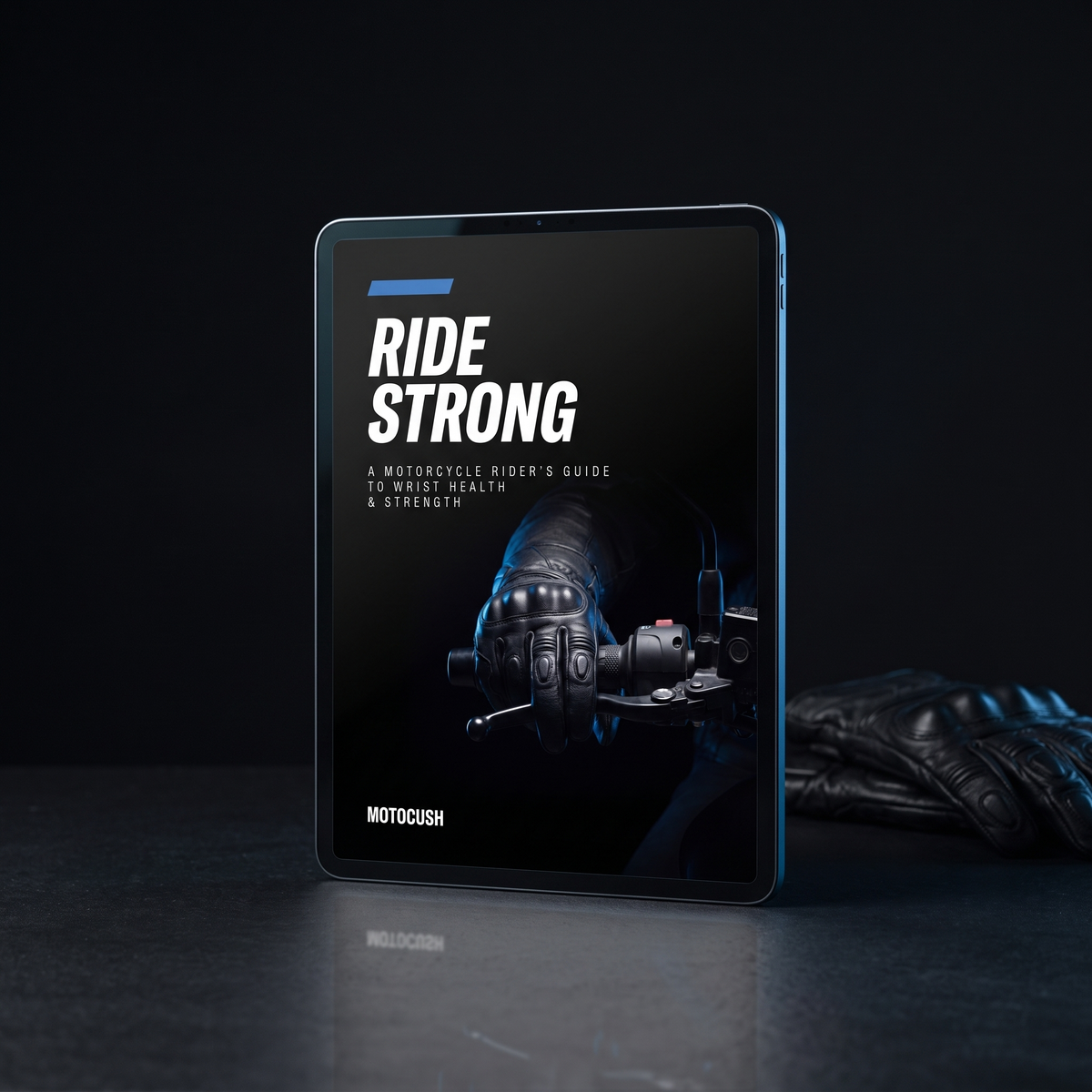 The Ride Strong rider guide on a tablet beside a pair of riding gloves