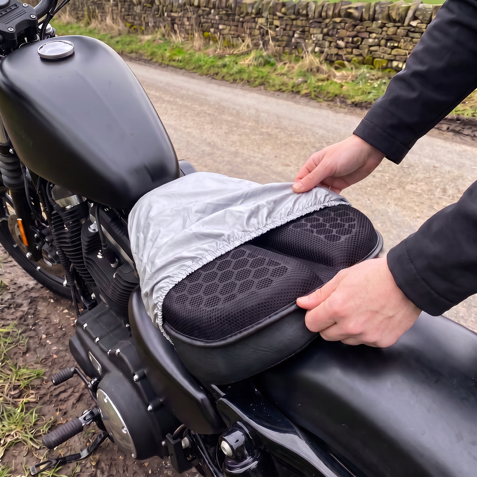 Hands pulling the silver rain cover over the gel seat pad