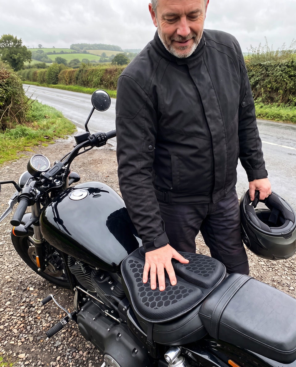 Rider pressing the MotoCush gel seat pad on his cruiser at a lay-by