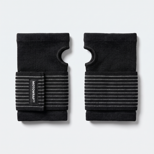 A pair of MotoWrap wrist supports lying flat
