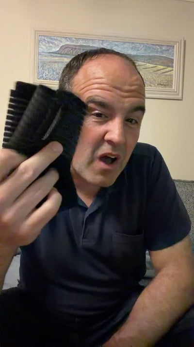 A rider holds up his MotoWrap and talks about it